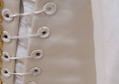 version of the Eleanor of Pentathalon 2025 Toledo dress in ivory silk satin eyelets photo by Kathryn Wolters